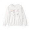 Arabic sisters sweatshirt, with the Arabic quote – Sisters are different flowers from the same garden. In a floral design.