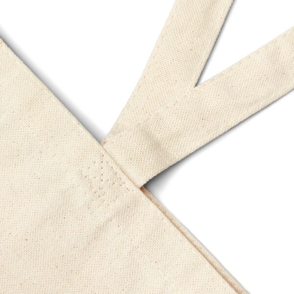 Close-up of مزاجية Arabic typography with Emotionally Scheduled illustration on tote bag