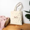 Arabic Tote Bag that has a word Mazajiya in Arabic and Emotionally Scheduled in English front design on natural cotton bag