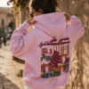 Woman wearing pink Lebanese Hoodie with vintage Lebanon artwork