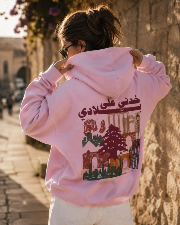 Woman wearing pink Lebanese Hoodie with vintage Lebanon artwork